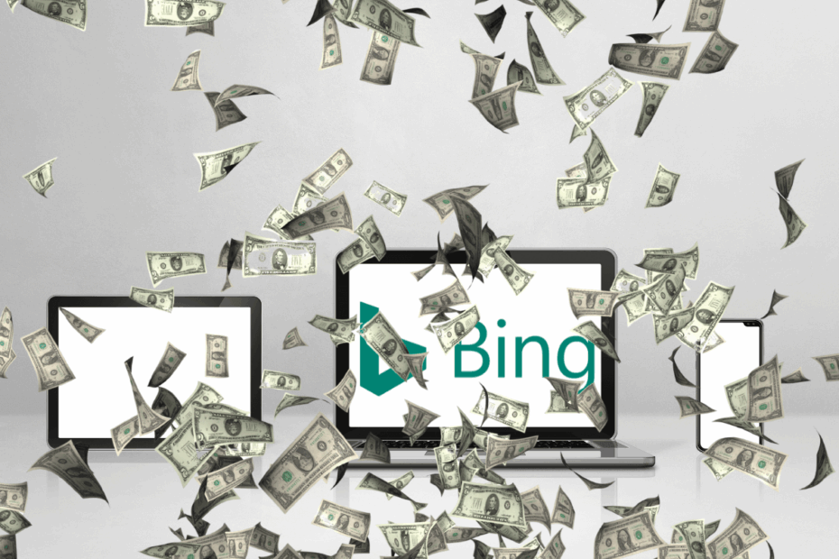 Notebook, tablet e celular exibindo o logo do Bing sob uma chuva de notas de dinheiro, ilustrando como ganhar dinheiro no Microsoft Rewards usando múltiplos dispositivos.