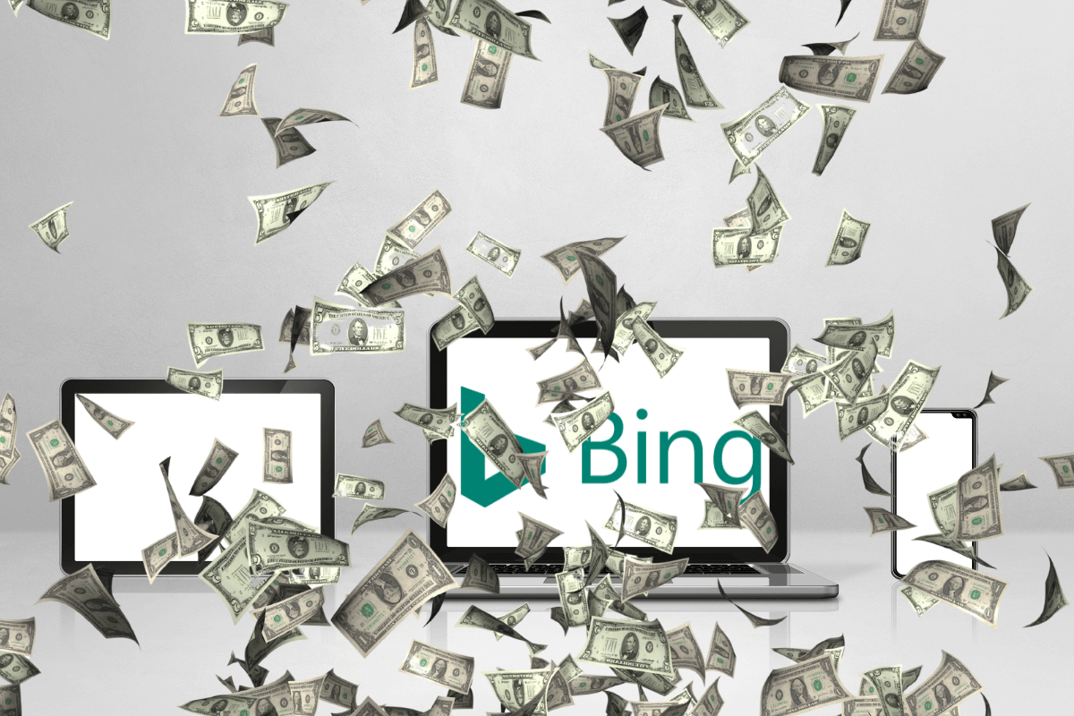 Notebook, tablet e celular exibindo o logo do Bing sob uma chuva de notas de dinheiro, ilustrando como ganhar dinheiro no Microsoft Rewards usando múltiplos dispositivos.